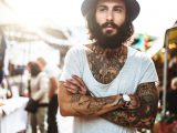 Hipster portrait with body full of tattoo